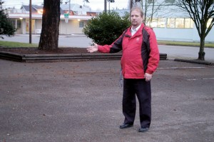 Major John Tumey of the Port Angeles Salvation Army stands in a now empty parking lot where a group of squatters were recently cleared.  Chris McDaniel/Peninsula Daily News ()