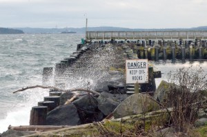Waves break over one of the Port Hudson breakwaters that protect the marina from rough seas. Photo by Charlie Bermant/Peninsula Daily News ()