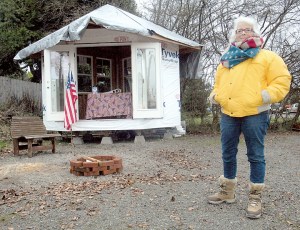 Betsy Reed Schultz stands outside a gazebo behind the Captain Joseph House in Port Angeles where she and several volunteers will spend 24 hours starting this afternoon as they raise money to assist with the renovation of the former bed-and-breakfast into a respite house for the families of fallen soldiers. (Keith Thorpe/Peninsula Daily News)