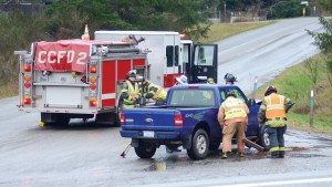 Clallam County Fire District No. 2 firefighters and the State Patrol assist a driver involved in a head-on collision on state Highway 112 near Power Plant Road west of Port Angeles.  Jay Cline/Clallam County Fire District No. 2 ()