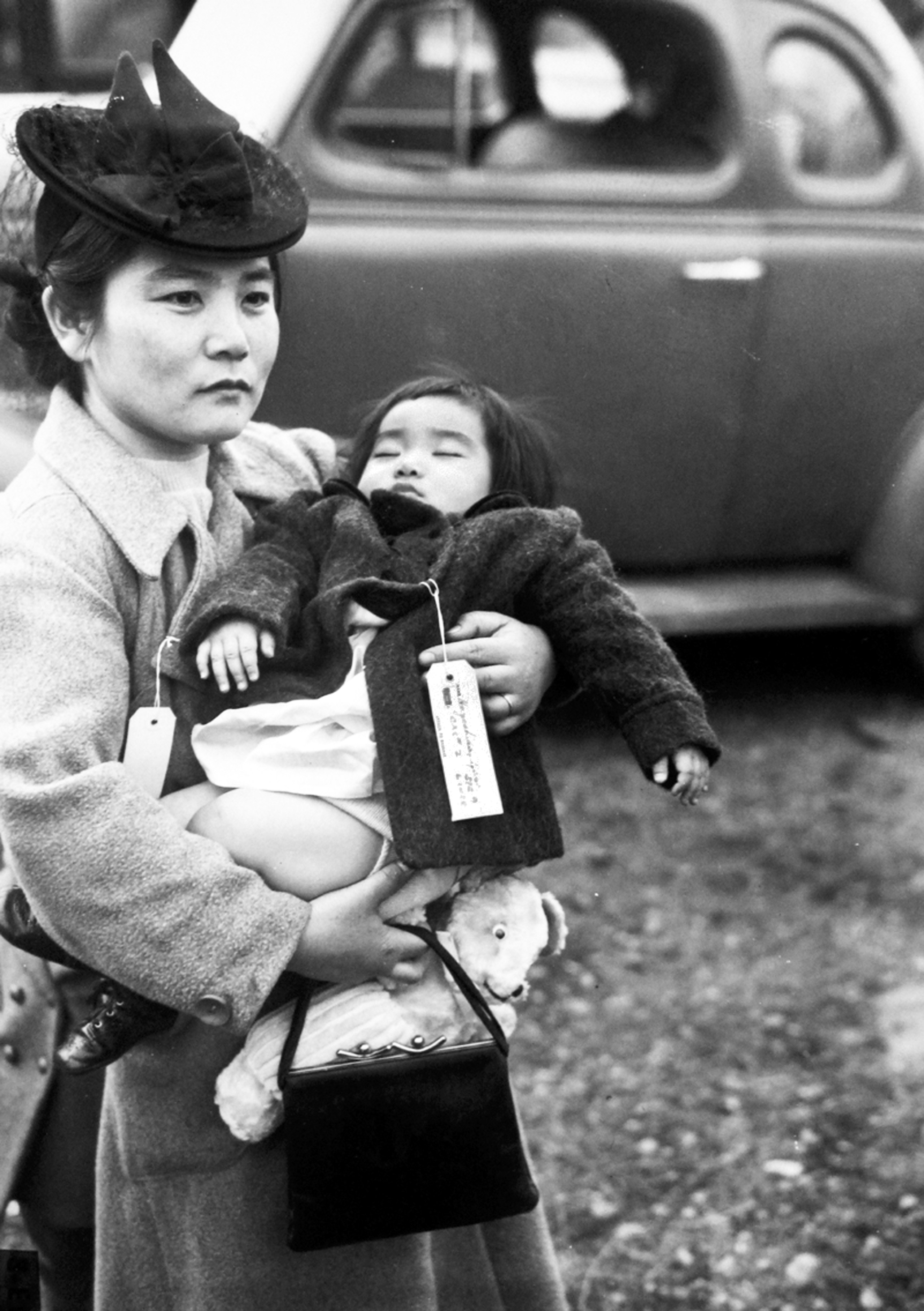 With her daughter asleep in her arms
