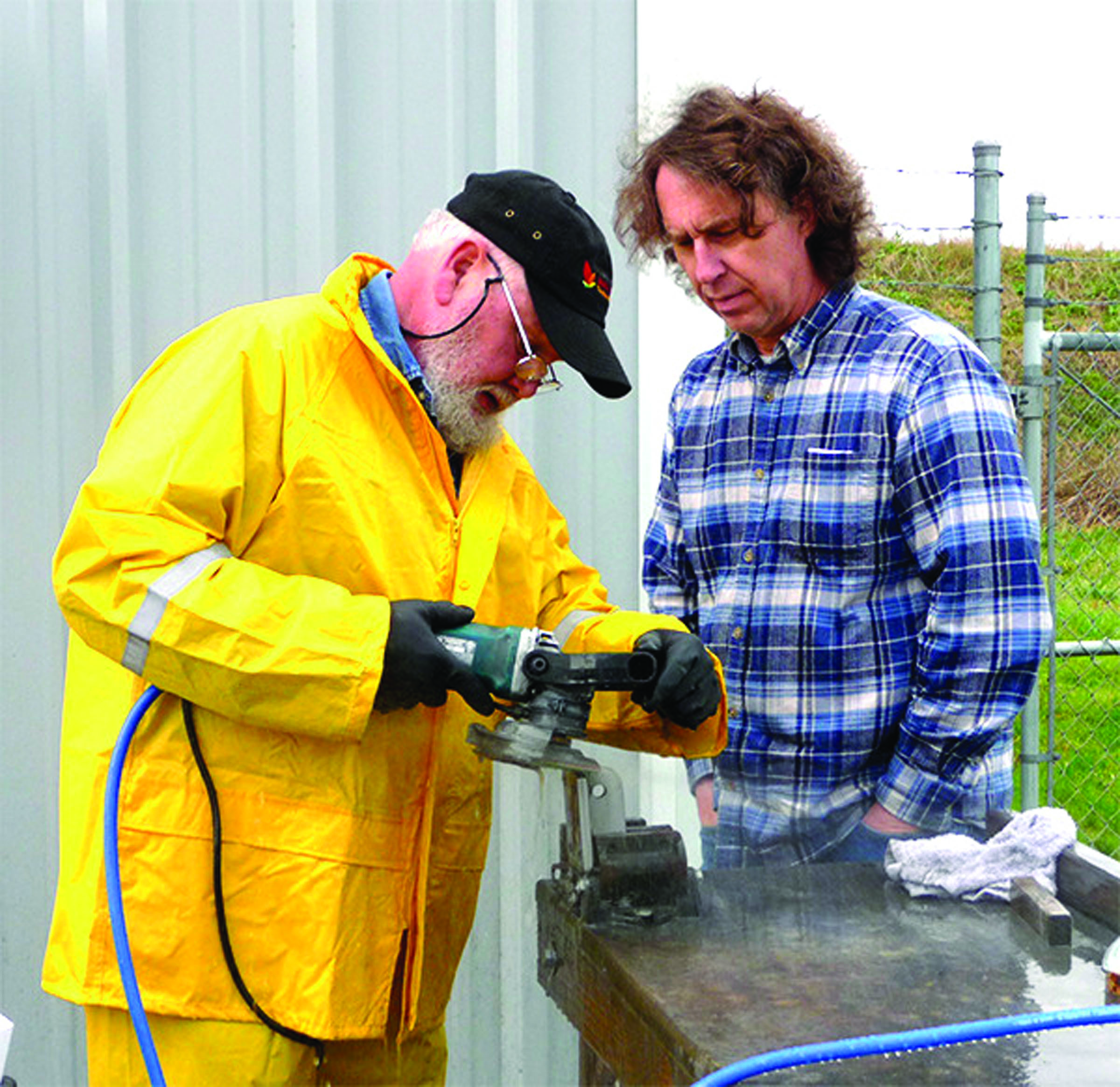 Machinist Bobby Kelly diamond polishes a high strength marine part as Allied Titanium CEO Christopher Greimes watches the process.  Patricia Morrison Coate/Olympic Peninsula News Group ()