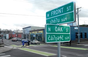 A newly installed street identification sign at Front and Oak streets in downtown Port Angeles indicates the location in both the English and Klallam languages. (Keith Thorpe/Peninsula Daily News)