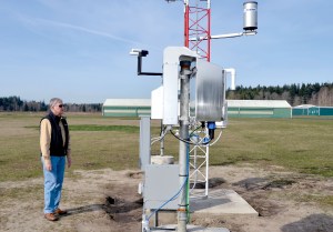 Port of Port Townsend Director Larry Crockett inspects the newly installed AWOS weather reporting system at Jefferson County International Airport.  Charlie Bermant/Peninsula Daily News ()