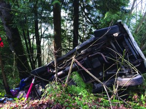 A diesel truck with five people inside flipped over Tuesday afternoon on state Highway 20. (East Jefferson Fire-Rescue)