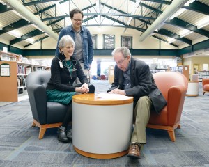 Port Angeles Mayor Patrick Downie signs the deed conveying the Port Angeles Library to the North Olympic Library System on Feb. 25. Observing are Library Director Margaret Jakubcin and Port Angeles Main Library Manager Noah Glaude.  Garrett Fevinger/North Olympic Library System ()