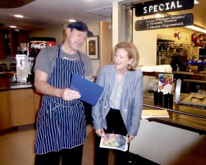 Jefferson Healthcare chef Arran Stark and marketing director Kate Burke go over the last-minute details for Saturdays Health