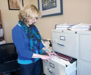 Port of Port Townsend Human Resources Director Abigail Berg takes an inventory of applications for the open port director position.  Charlie Bermant/Peninsula Daily News ()