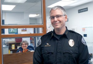 Mike Evans was promoted to Port Townsend police chief on April 1 after serving in the interim position for nearly a year. Also pictured is volunteer Bonnie Toepke.  Charlie Bermant/Peninsula Daily News ()