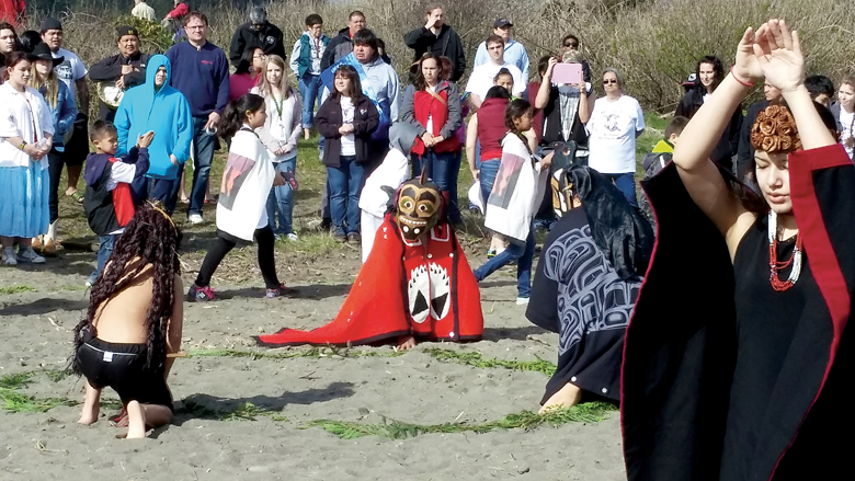 Children dance during the Quileute tribes whale song during the ninth annual Welcoming of the Whales ceremony near First Beach in La Push on Friday. Several gray whales appeared just offshore flipping their tales and spouting during the ceremony