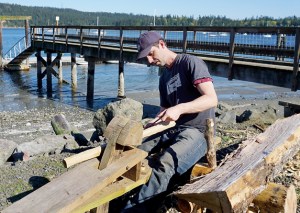 Ethan Hickman of Olympia participated in a workshop on 11th century boat-building techniques this weekend at the Northwest School of Wooden Boatbuilding in Port Hadlock. (Charlie Bermant/Peninsula Daily News)