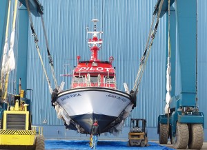 The Puget Sound Pilots boat Juan de Fuca is shown in the slings of the Platypus Marine Inc. TraveLift. Photo by David G. Sellars/for Peninsula Daily News ()