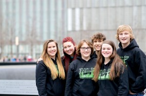 Following their performance on the 9/11 Memorial plaza are Port Angeles High School choir members