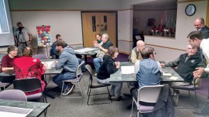 Port Angeles residents discuss 10 elements of the city plan in a comprehensive planning workshop Wednesday evening at the North Olympic Peninsula Skills Center. Each table of participants graded elements of the community and suggested where the city should put its resources.  Arwyn Rice/Peninsula Daily News ()