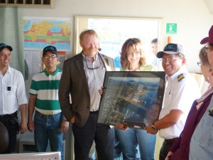 A picture of Port Angeles is presented to Alaska Capt. Morado Saguid