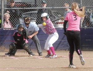 Port Angeles' Taylar Clark eyes the pitch from Sequim's Allysen Montelius