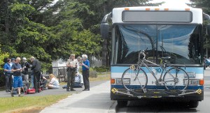 Medical personnel and law enforcement investigate the scene after a passenger on a Clallam Transit bus attacked passengers and the bus driver in the 1600 block of West 16th Street near the Clallam County Fairgrounds in Port Angeles on Saturday.  Keith Thorpe/Peninsula Daily News ()