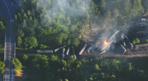 An oil train burns near the Oregon town of Mosier after derailing Friday.  Alan Berner/The Seattle Times via AP ()