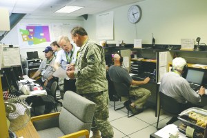 Volunteer radio operators participate in an earthquake and tsunami readiness drill Tuesday at Camp Murray. Their role is to help bridge the gaps for emergency officials if internet and phone services are severed after a mega-quake. (The Associated Press)