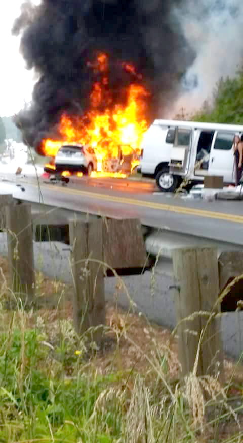 Jamestown S'Klallam tribal employee Steve Johnson took this photo of vehicles aflame in the Blyn wreck. (Steve Johnson)