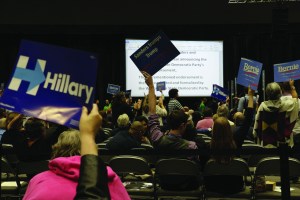 Democrats wave signs at the state Democratic convention in Tacoma on Saturday. State Democrats met to pass a party platform and finish electing delegates to the national convention this summer.  The Associated Press ()