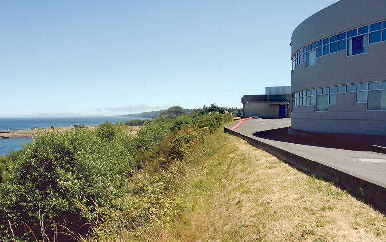 Olympic Medical Center is developing plans to have a retaining wall retaining structure built into the bluff on the northwest edge of the hospital building in Port Angeles. Keith Thorpe/Peninsula Daily News
