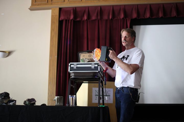John Cornish making a presentation about fluorescent rocks. New England Mineral Association