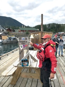 Thomas Nielsen of Team Sea Runners rings the finish bell in Ketchikan after completing the voyage from Port Townsend.  Race to Alaska ()