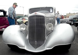 Larry Baze of Agnew looks over a vintage 1933 Pontiac on display at 2014s Darlene Marihugh Cruz-In car show in Port Angeles. The event