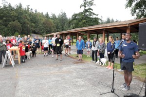 Shawn Ellison sings the national anthem before the start of the Deer Run last Saturday at Naval Magazine Indian Island. — Phillip L. Guerrero/Naval Magazine Indian Island ()