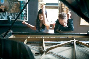 Elizabeth Joy Roe and Greg Anderson lay four hands on one piano.