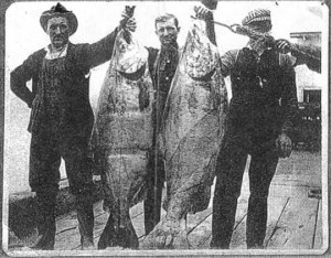 This undated photograph shows two unidentified fishermen in Astoria