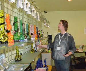 Gracen Hook stocks the shelves at Reefer Den