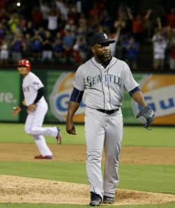 Relief pitcher Fernando Rodney heads to the dugout after walking Texas' Adrian Beltre with bases loaded to give the Rangers the win Monday. The Associated Press