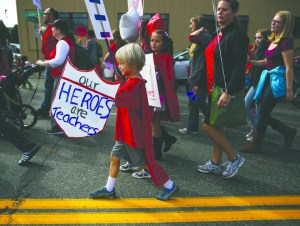 Supporters of striking Seattle teachers take part in a march and rally Tuesday in Seattle. The Associated Press