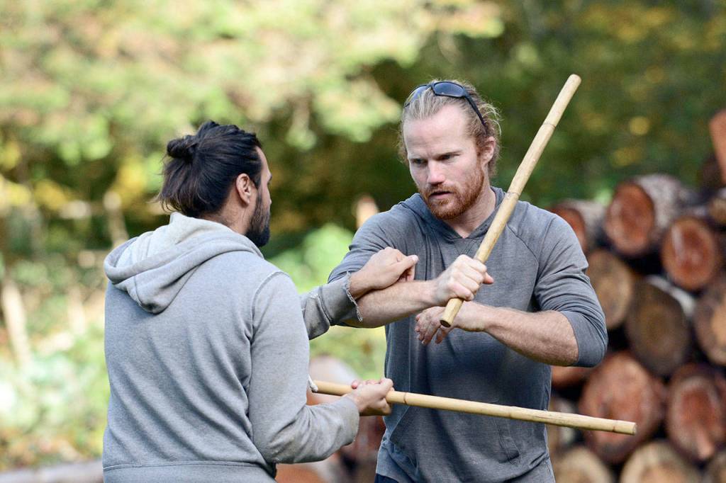 Alex Tienda of Sequim, left, and Michael Lazzari of Sequim run through an Eskrima drill at Tribal Edge. (Jesse Major/Peninsula Daily News)