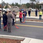 Port Townsend city officials, Jefferson County commissioners and community members gather for a ribbon-cutting for the new Rainier Street in Port Townsend on Wednesday morning. (Port Townsend Public Works Department)