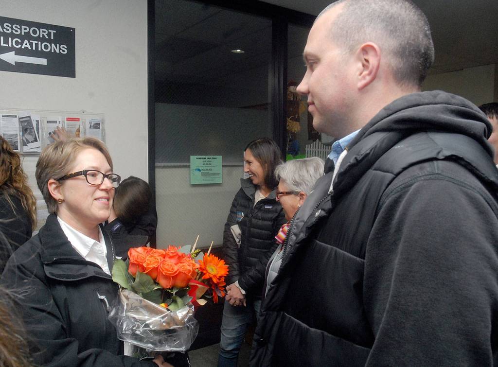 Port Angeles City Council candidates Kate Dexter, left, and Mike French exchange greetings on election night at the Clallam County Courthouse. Dexter held a slim lead on Tuesday while French was effectively unopposed after his opponent, Jacob Oppelt, withdrew from the race. (Keith Thorpe/Peninsula Daily News)