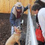 WAG volunteer Glen Varvil and 3-year-old Rosie greet visitors to the organization&rsquo;s open house Oct. 28.