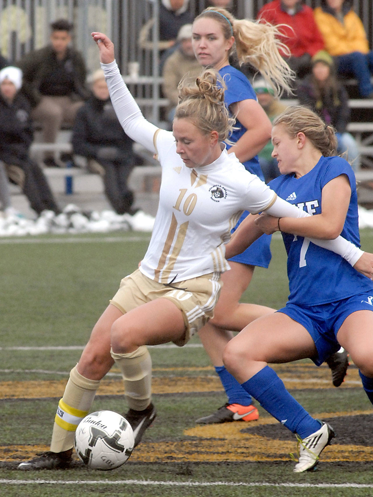 Keith Thorpe/Peninsula Daily News Peninsula&rsquo;s Kelly Kevershan, front, fends off Lane&rsquo;s Kyla Ganchan Romero, right, and Gwyn Anderson during Saturday&rsquo;s NWAC quarterfinal playoff game at the Wally Sigmar Sports Complex in Port Angeles.