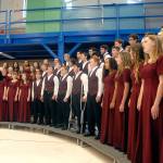 The Select Choir from Sequim High School, directed by John Lorentzen, sings The Star-Spangled Banner in the hanger at U.S. Coast Guard Air Station/Sector Field Office on Veterans Day. (Keith Thorpe/Peninsula Daily News)