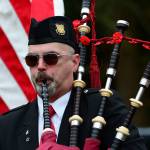 Rick McKenzie, a retired Coast Guard veteran, plays bagpipes during the Sojourners memorial service for Marvin G. Shields on Saturday. (Jesse Major/Peninsula Daily News)
