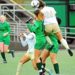 Peninsulas Janis Martinez-Ortiz (24) leaps high to head a ball against Highline in the Northwest Athletic Conference title game Sunday. Also in oin the play is Peninsulas Brianna Duran (2). Highline scored in overtime to win 1-0. (Jay Cline/for Peninsula Daily News)