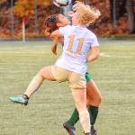 Peninsulas Maddy Parton battles with a Highline player for a loose ball in the NWAC championship match Sunday held in Tukwila. (Jay Cline/for Peninsula Daily News)
