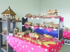Items like these hand-carved wooden vehicles will be offered for sale at the 10th annual JeffCo Holiday Fair at the Jefferson County Fairgrounds in Port Townsend on Saturday and Sunday