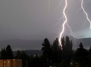 A bolt of lightning hits above the Peabody Heights section of Port Angeles near Port Angeles High School about 5:30 a.m. today. Keith Thorpe/Peninsula Daily News