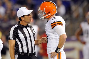 Referee Gene Steratore talks with Cleveland Browns quarterback Brandon Weeden before an NFL football game against the Baltimore Ravens in Baltimore on Thursday. The Associated Press