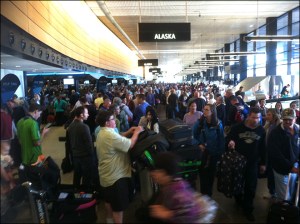 Long lines and passenger confusion abound near the Alaska Airlines ticketing area at Seattle-Tacoma International Airport this morning. KOMO News