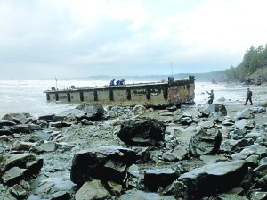 Dock is precariously positioned on the rocky beach. Washington Dept. of Fish & Wildlife