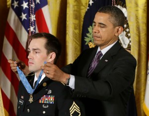 President Obama presents former Army Staff Sgt. Clinton Romesha with the Medal of Honor. The Associated Press